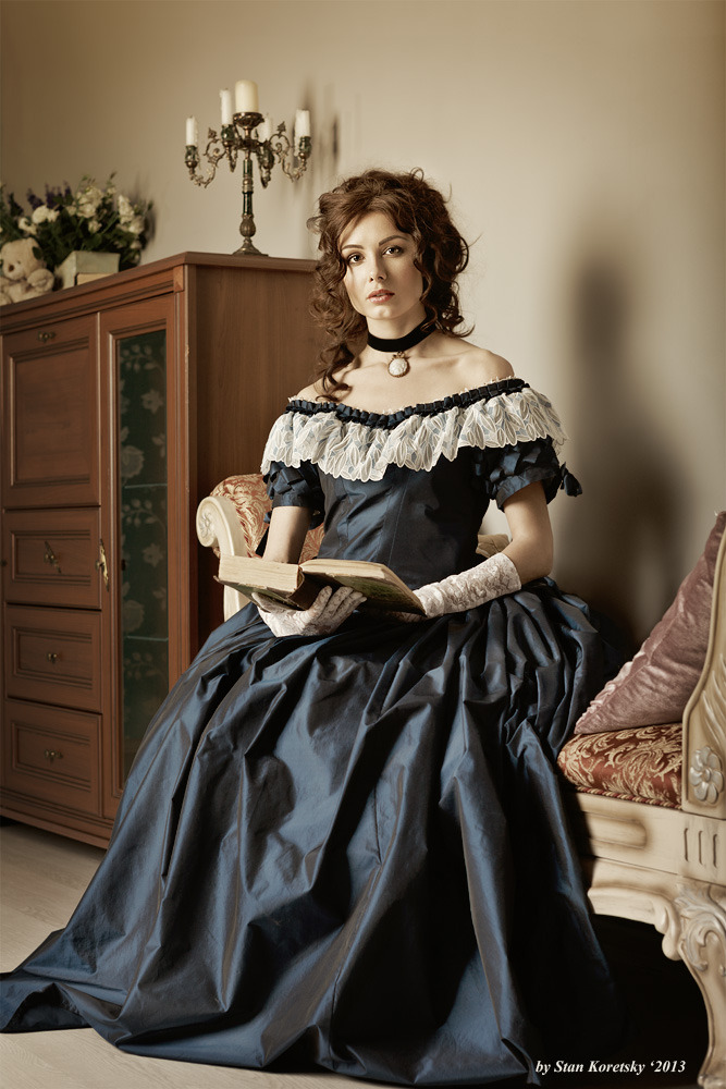 Woman wearing old fashioned dress | old fashioned dress, candles, room, book