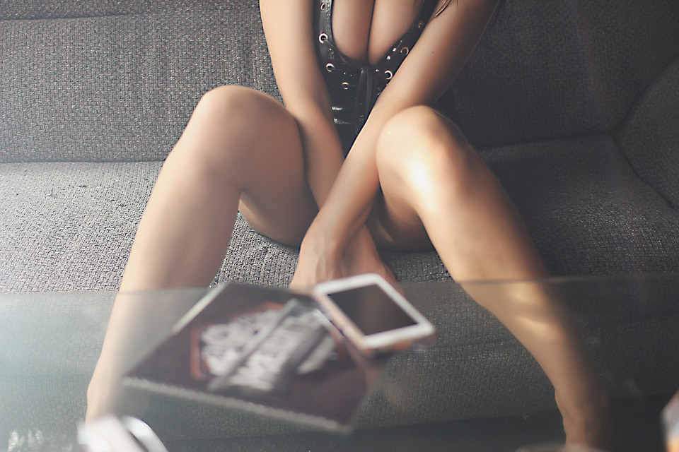 Girl waiting for call | glamour, model, girl, sofa, legs, table, mobile phone, decollete, club, top